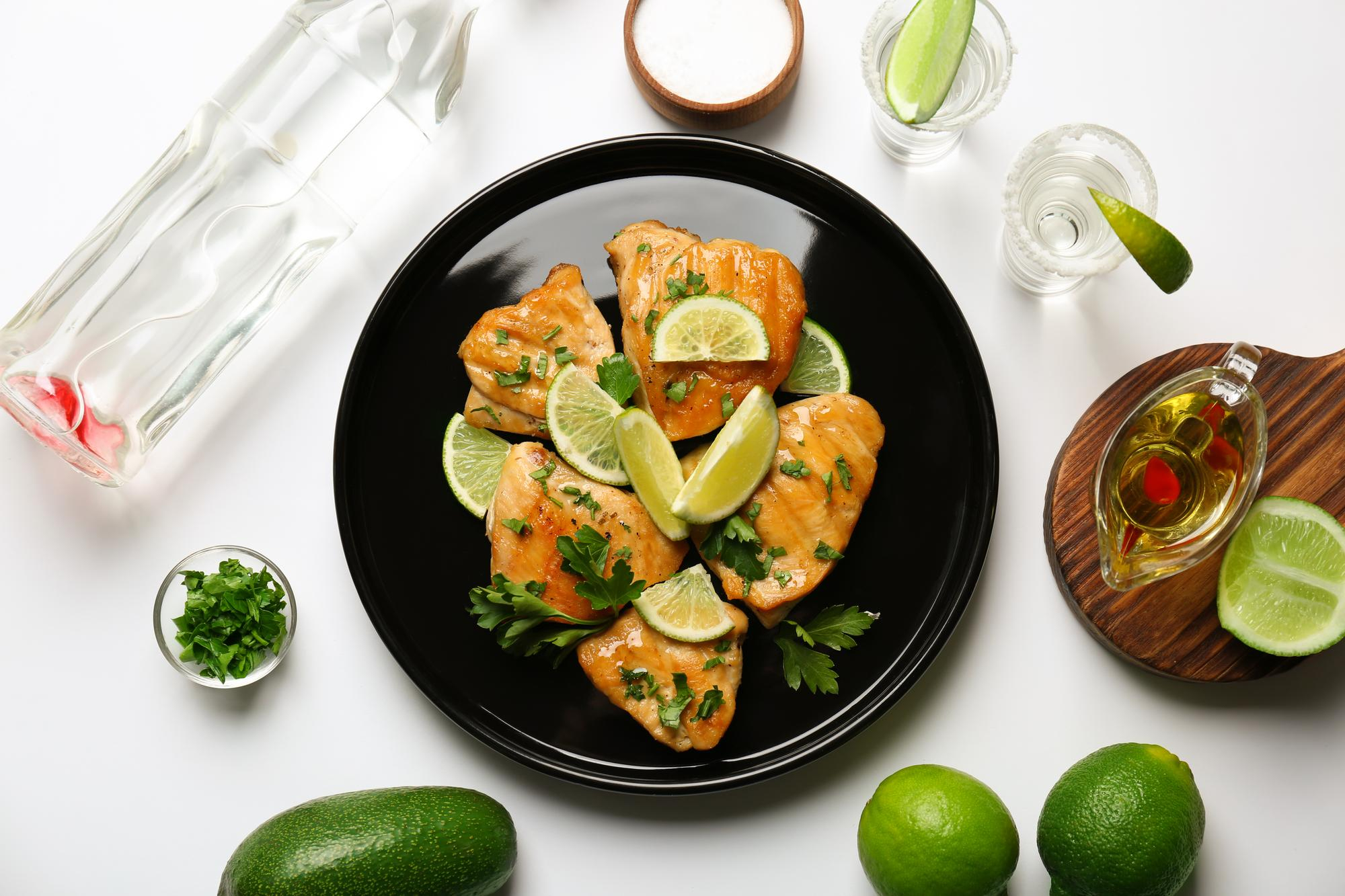 Ginger and calamansi grilled fish served with rice, mango, cucumber and fresh greens